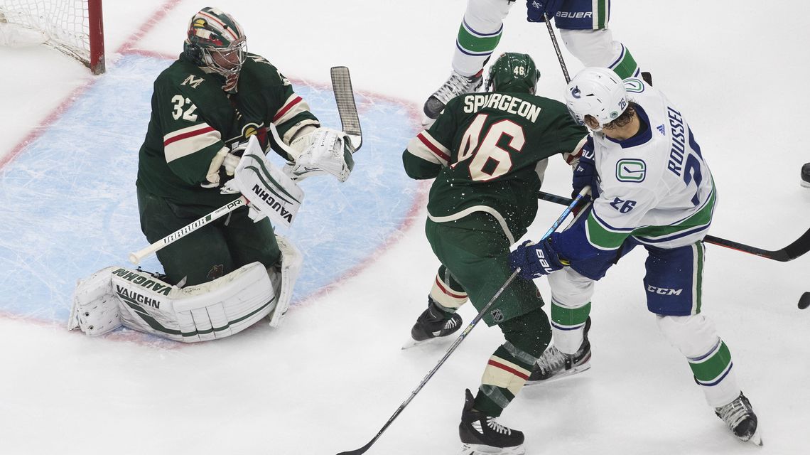 Tanev scores 11 seconds into OT as Canucks beat Wild 5-4