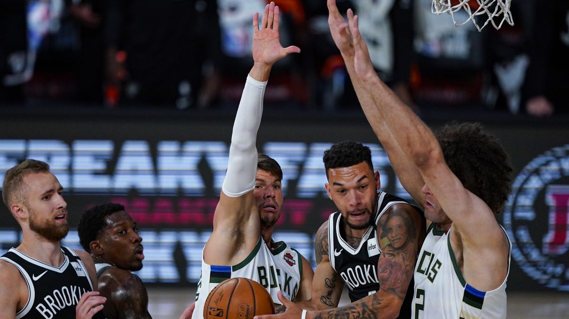 Giannis watches in 2nd half as Nets beat Bucks 119-116