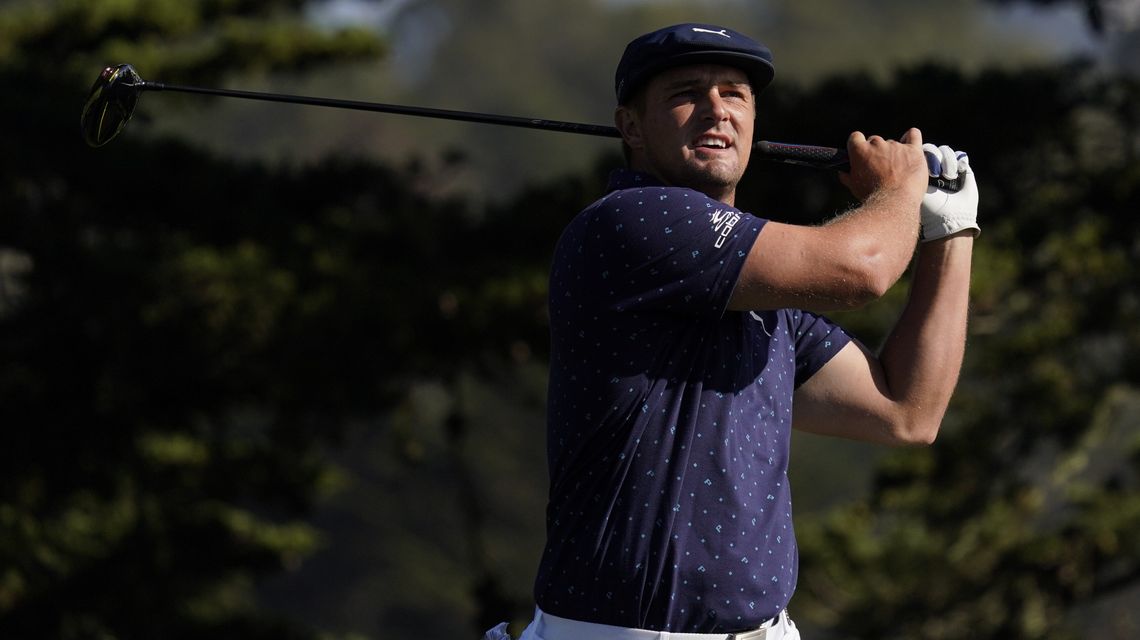 Cracked up: Driver snaps, but DeChambeau powers through