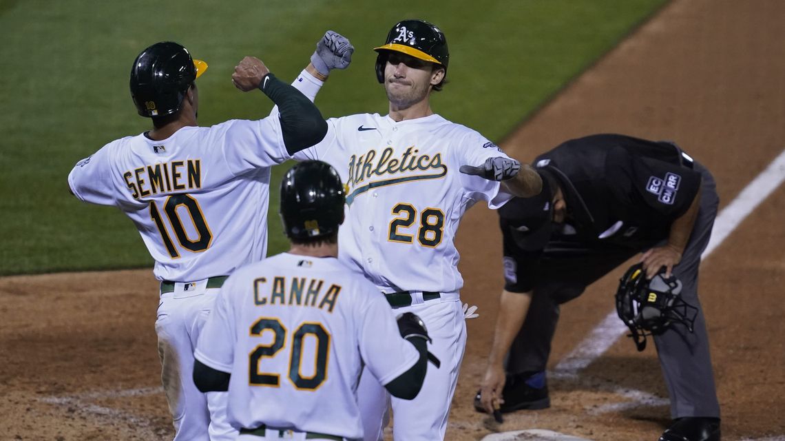 A’s clinch playoff berth with win over Giants, Mariners loss