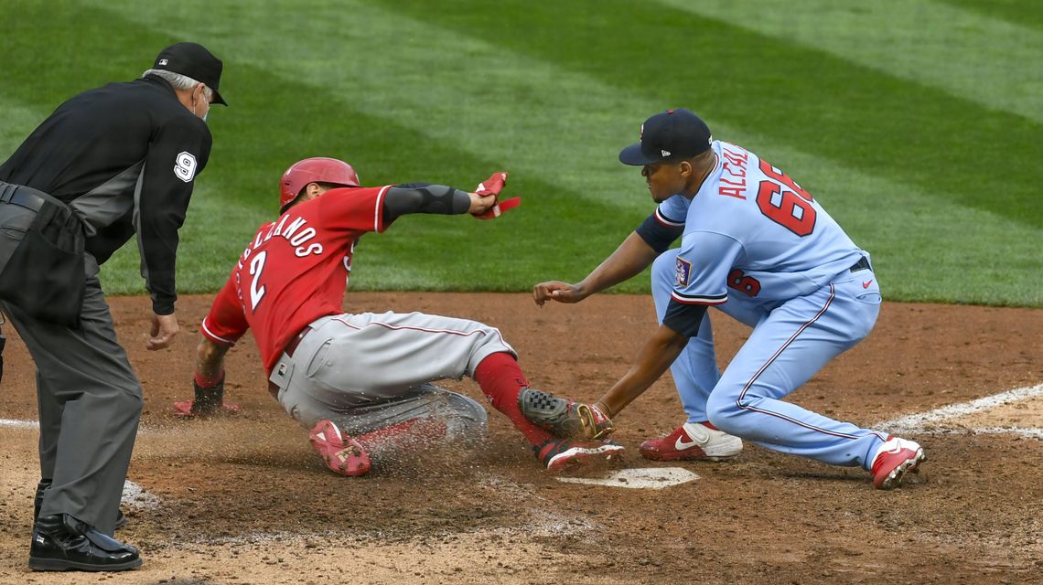 Reds beat Twins 5-3 in 10; Minnesota wins AL Central