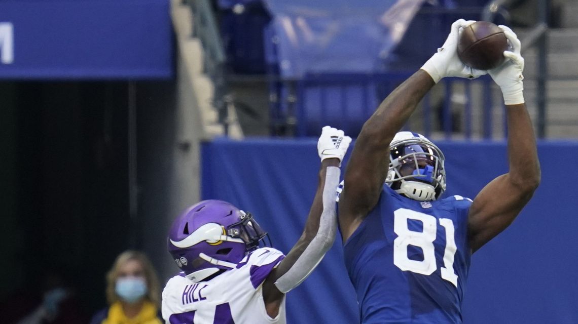 Taylor makes hefty workload pay off as Colts beat Vikings