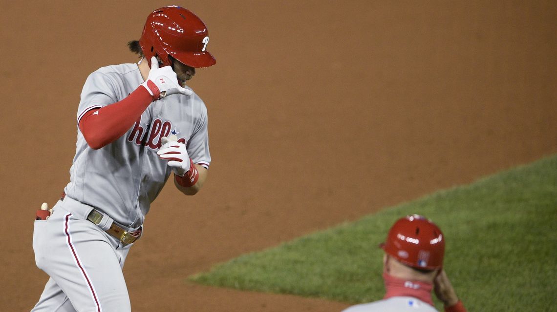 Harper’s 2 HRs help Phils top Nats 12-3, push champs to edge