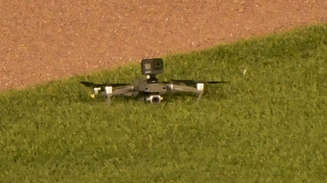Drone lands in outfield at Wrigley Field, causing delay