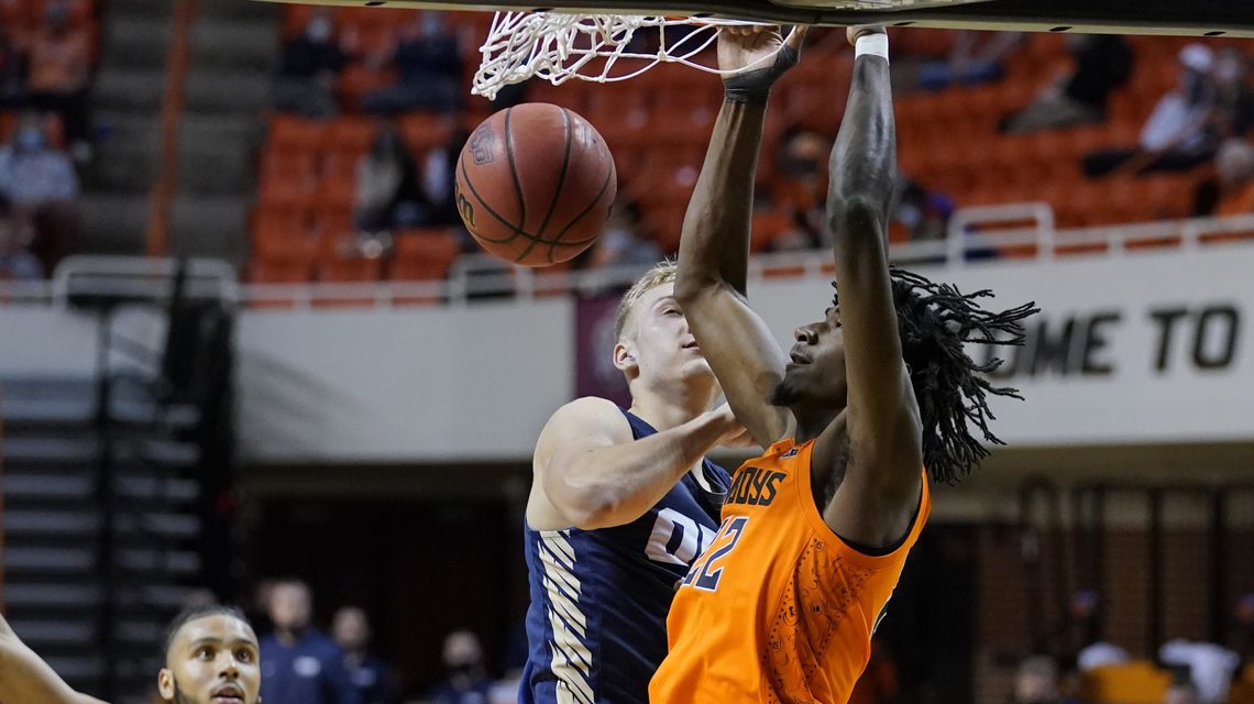 Cunningham outduels Abmas, Oklahoma St. beats Oral Roberts