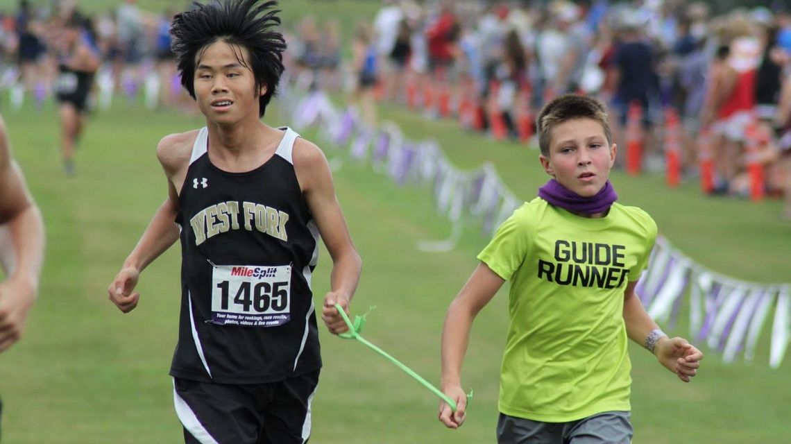 Joined at the rope: Fourth-grade guide runner steps up to help West Fork freshman