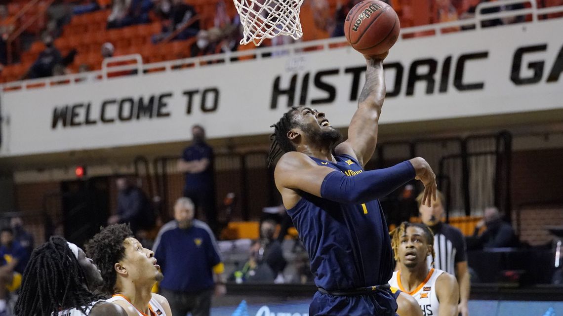 Culver leads No. 14 West Virginia from 19 down past Okla St