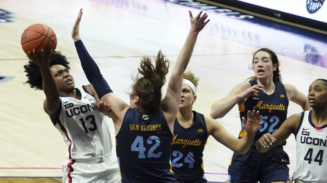 No. 1 UConn ends regular season by beating Marquette 63-53