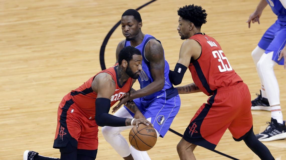 Wall scores 31, Rockets end skid with 102-93 win over Mavs
