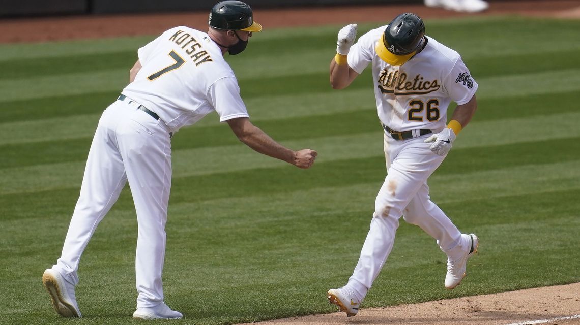 A’s rally to beat Dodgers 4-3 in 10 for 1st win of season