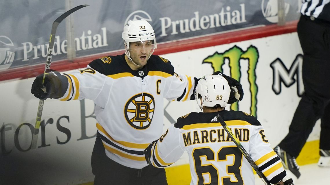 Bergeron, Bruins blank Devils to clinch playoff spot