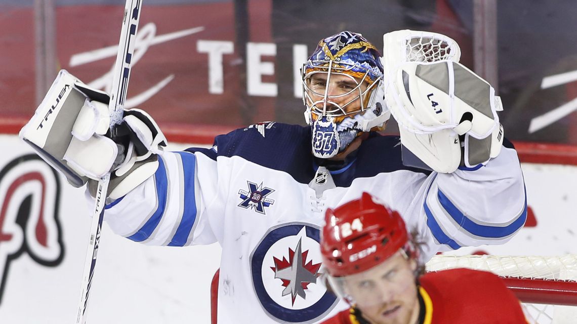 Jets clinch playoff spot, beating Flames to end skid