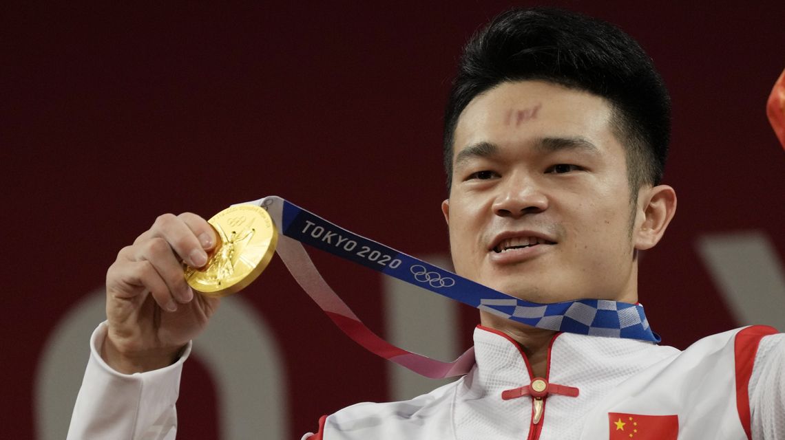 China’s Shi breaks own record to win weightlifting gold
