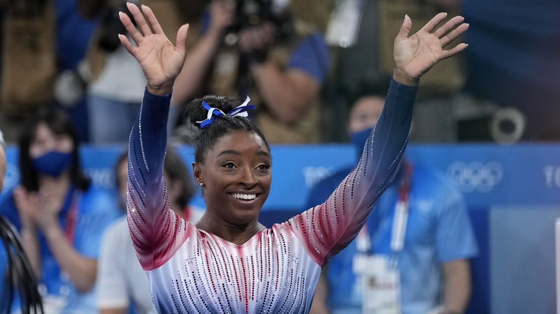Biles returns to competition with a bronze medal and a smile