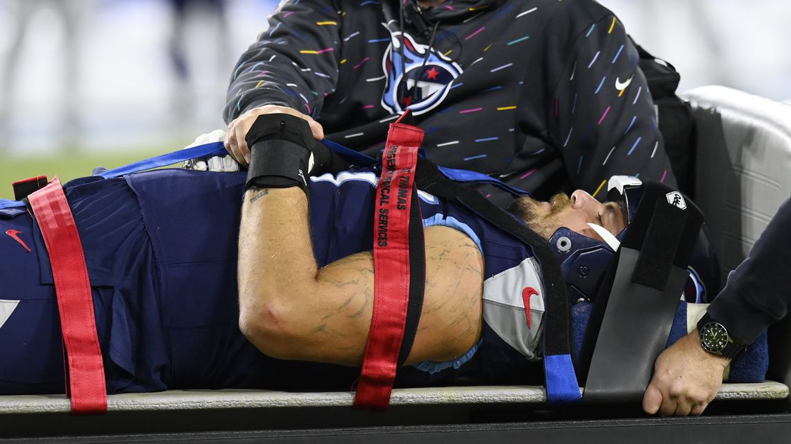 Titans left tackle Taylor Lewan carted off field with injury