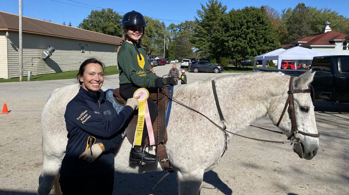 Elizabeth Wold, 9, rides favorite horse ‘Sparky’ in her first show at Knollwood Farm