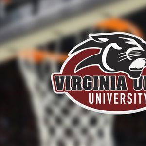 Behind coach Tierra Terry’s VUU basketball clipboard