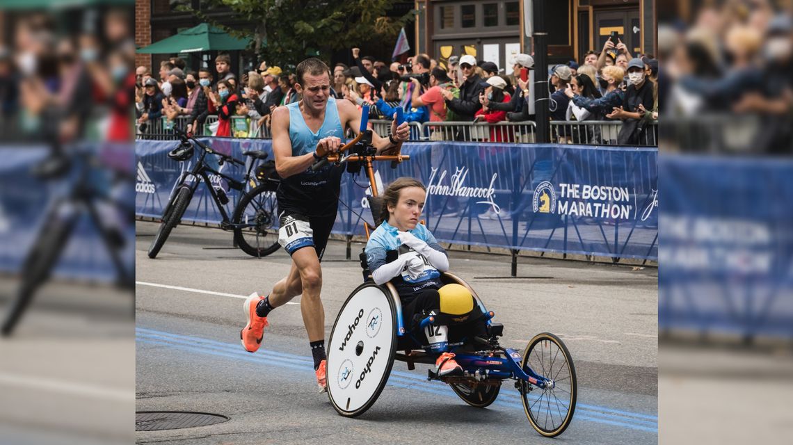 GA athletes break world record for fastest man pushing a wheelchair in a marathon