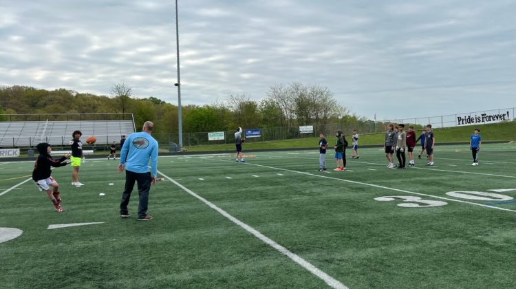 Urbana HS football coaches team up with youth program for clinic