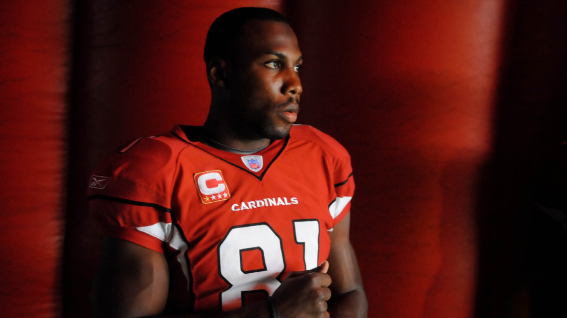 Arizona Cardinals wide receiver Anquan Boldin, right, stretches with  teammate Larry Fitzgerald Thursday, Sept. 10, 2009 during football workouts  in Tempe, Ariz. The Cardinals face the San Francisco 49ers on Sunday. (AP