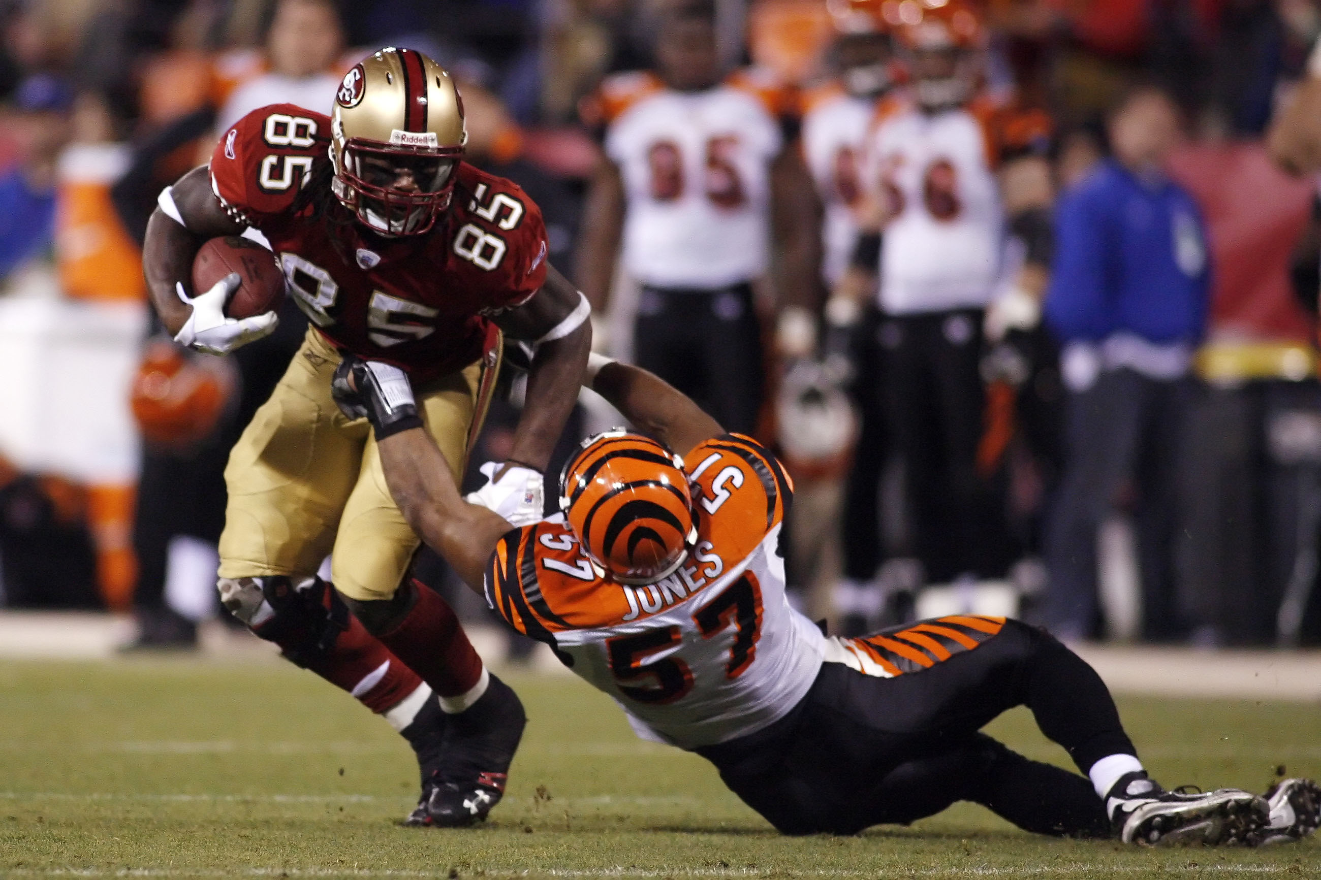 San Francisco 49ers tight end Vernon Davis being tackled in a game against the Cincinnati Bengals. 